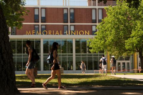 Students pass the new front of the newly reopened Memorial Union